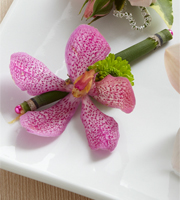 The FTD Pink Mokara Boutonniere